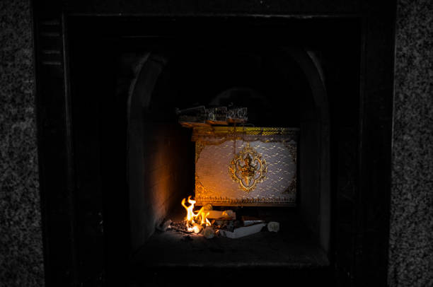 Thai religious ritual for the cremation. The corpse in the coffin is burning in the cremate.