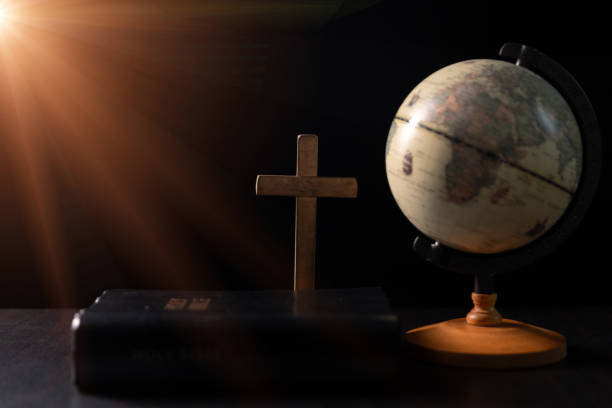 Missionary embarked on mission across the earth, armed with faith in Jesus Christ and a map, spreading the teachings of Christianity and the Bible to fulfill God's call within the Christian religion.